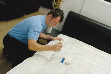 Technician is in the process of repairing the bed