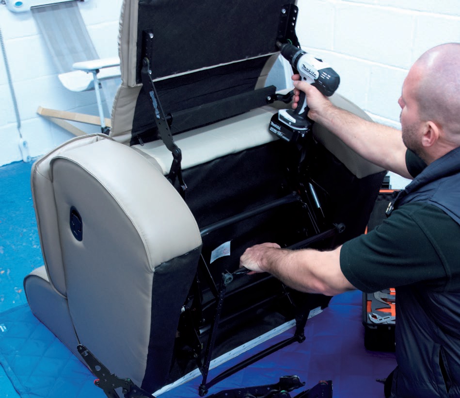 Carrying out a repair on recliner mechanism in the workshop