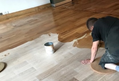 Technician creating a floor plan of a restaurant on a tablet