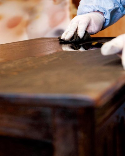 Emmiera Group Technician upholstering a sofa in our dedicated workshop