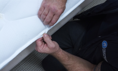 Sewing a mattress to repair it